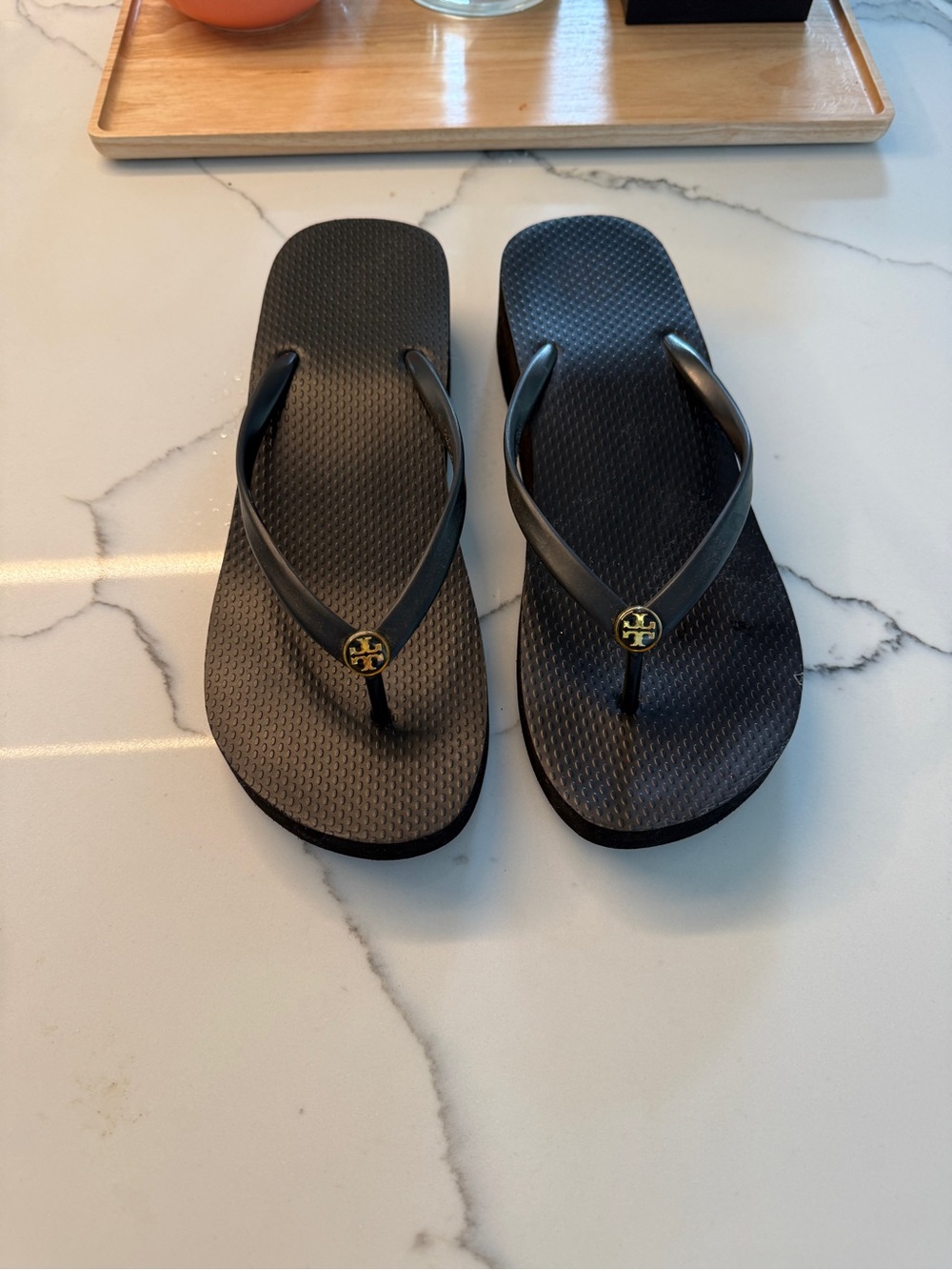 Tory Burch Black Flip Flop Sandals with Gold Logo Medallions